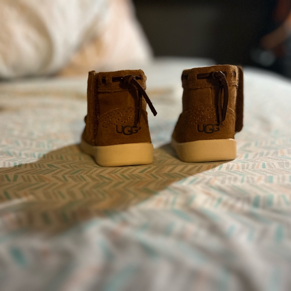 Ugg infant boots. Never warn. Bought them and they never fit.
